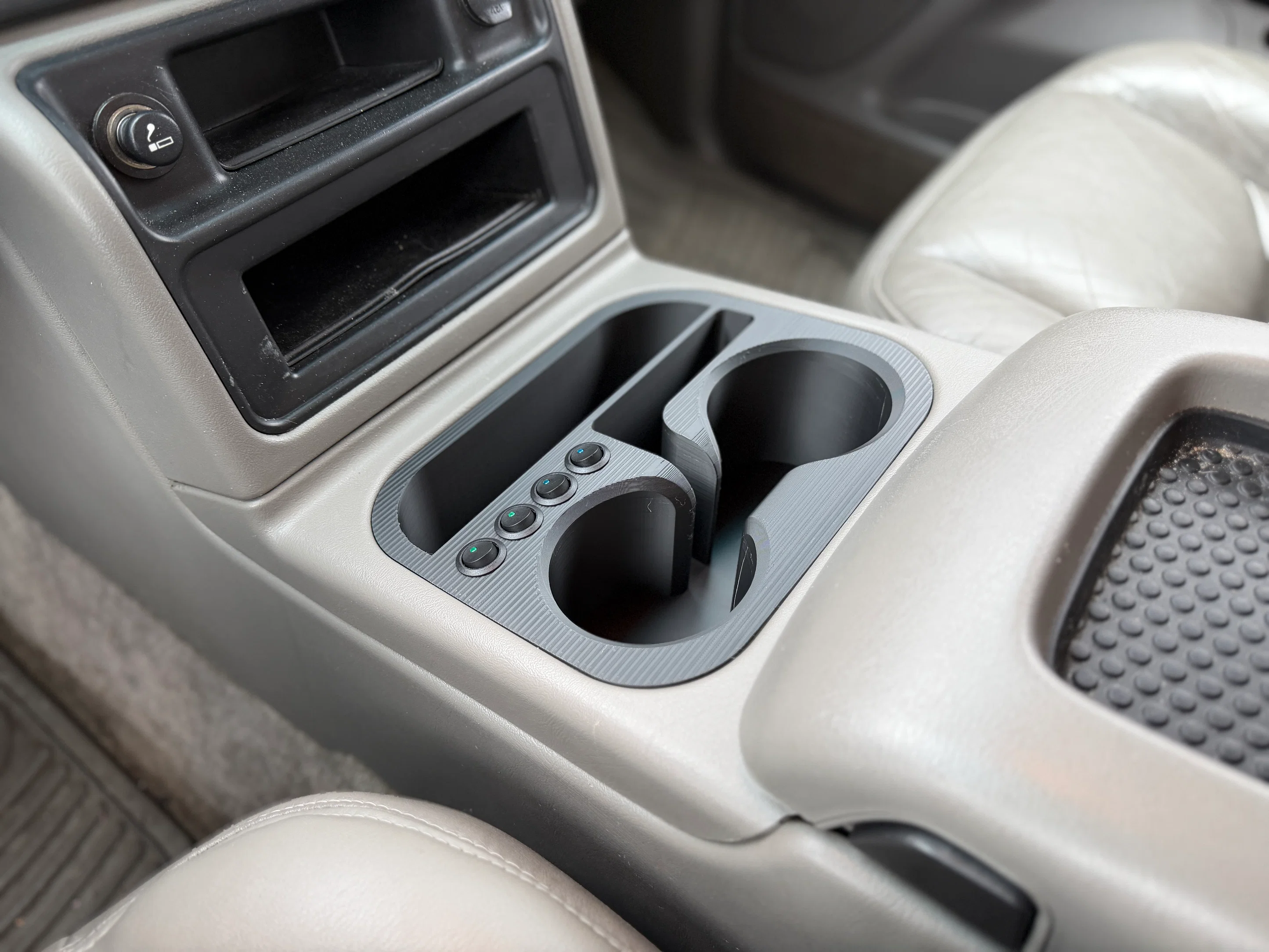Custom cup holder insert with integrated switch panel installed in a GMT800 center console